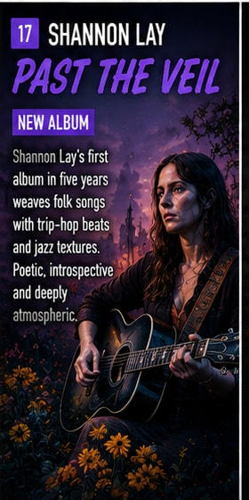 Shannon Lay with acoustic guitar in shadowy natural light.