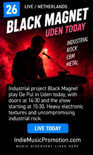 Black Magnet performing with industrial synthesizer equipment and metal guitars.