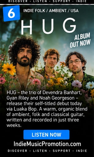 The three members of HUG standing among flowers in a warm organic portrait.
